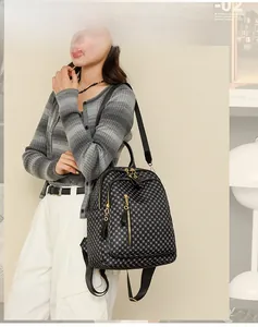 Close-up of vintage geometric pattern on woman backpack with gold zipper detail
