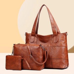 Brown 3-piece tote bag set with pebble leather texture and minimalist grid stitching