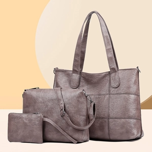 Three-piece smoky purple quilted tote bag set with matching crossbody and small pouch