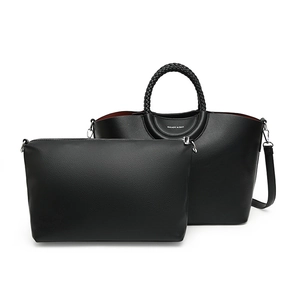 Black pebbled leather tote bag set with woven handles and matching zippered clutch