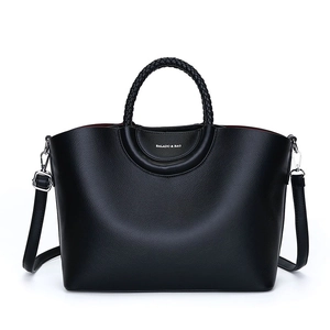 Large black pebbled leather tote bag with woven handles and adjustable shoulder strap