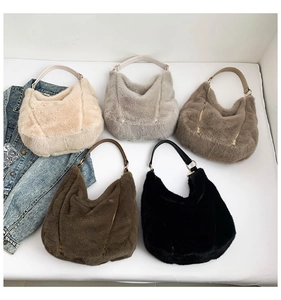 Faux fur hobo bags in five colors with PU handles shown in a group flat lay