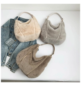 Flat lay of soft plush hobo bags in beige, grey and brown with leather straps