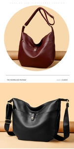 Detail view of burgundy and black hobo bags with textured pebbled leather and long straps