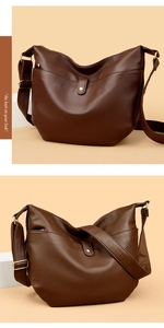 Detail of dark brown lychee grain leather bag with decorative pocket and wide strap