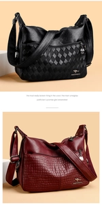 Detail view of large capacity shoulder bags in black woven and red crocodile patterns