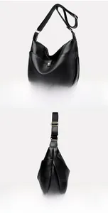 Detailed macro view of black lychee grain faux leather hobo bag with gold metal buckle