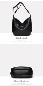 Detail view of black lychee texture handbag featuring a back zip pocket and a wide bottom