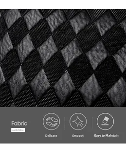 Detail of delicate black diamond lattice fabric with smooth and easy-care texture
