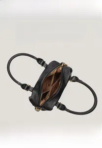 Detail view of large interior compartment with soft lining and zipper pocket for handbags