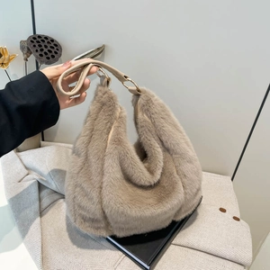Chic beige faux fur hobo bag with leather handles and gold-tone metal hardware accessories