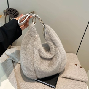 Faux fur shoulder bag in light grey with white leather handles and gold metal ring details