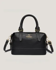 Detail of black Boston bag showing lychee grain leather and white contrast stitching