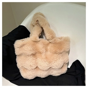 Macro shot of fluffy beige plush tote bag with wavy 3D texture for autumn and winter