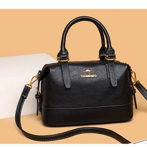 Detail of black pebbled leather Boston bag with gold kangaroo logo and white stitching
