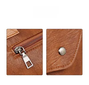 Close-up of brown lychee texture PU leather with smooth silver zipper and hardware details