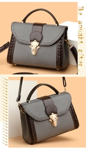 Detail of vintage patchwork handbag with grey fabric, brown leather, and gold clasp