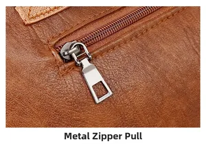 Close-up of durable silver hardware zipper and stitching on the brown PU tote bag