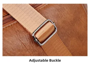 Close-up of adjustable strap buckle and lychee texture on large leather tote bag