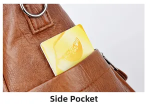 Detail view of brown PU leather tote bag side pocket with silver metal D-ring attachment
