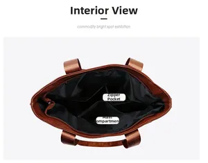 Internal view of the brown leather tote bag showing the main pocket and zipper pocket
