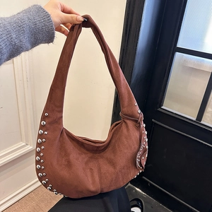 Brown suede hobo bag with silver rivets and crescent shape for women's autumn style