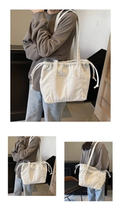 Detail view of cream corduroy tote bag with drawstring closure and front double pockets