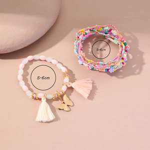 Set di braccialetti boho fatti a mano con ciondolo a farfalla e nappe colorate