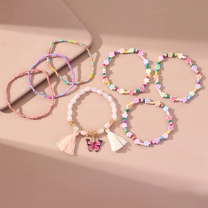Set di 7 braccialetti bohémien fatti a mano con perle rosa e ciondolo a farfalla