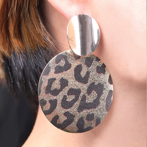 Chic leopard print geometric round drop earrings for women worn by a model