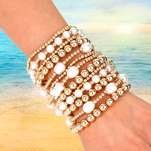 Detail of 13pc layered minimalist beaded bracelets with white faux pearls and gold beads