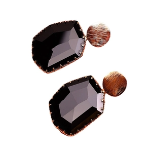 Elegant vintage-style stud earrings with black octagonal crystal and brushed gold discs