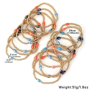 Detail view of colorful beads and gold CCB balls in an 18cm elastic bracelet set