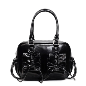 Glossy black vintage square handbag with bow details and contrast stitching