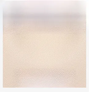 Close-up of litchi texture beige leather showing waterproof and soft material