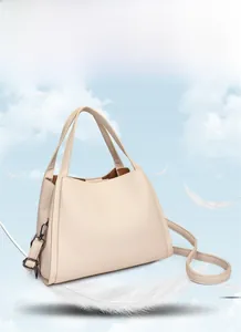 Detail of cream-white lychee grain tote bag showing its lightweight design and texture