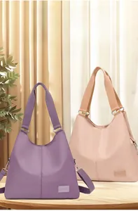 Detailed view of purple and beige waterproof nylon tote bags with adjustable wide straps