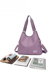 Purple waterproof nylon tote bag showing spacious interior for 13 inch laptop and tablet