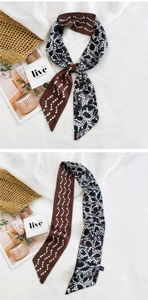 Détail de foulard en soie avec imprimés cœurs et motifs dentelle florale complexes
