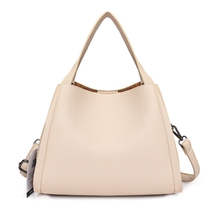 Minimalist beige lychee grain leather bucket tote bag with adjustable shoulder strap