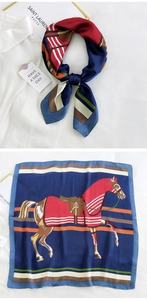 Detailed view of square silk scarf featuring vintage horse prints and colorful stripes