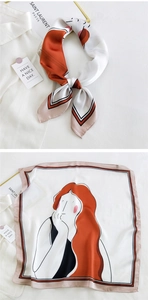 Detail of silk scarf with female cartoon illustration and orange stripe border