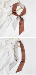 Detail of slim twilly silk scarf with deer print and elegant beige brown dual-color splice