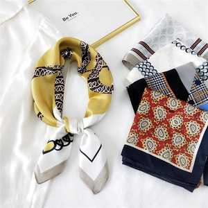 Fashionable square silk scarf with heart print and assorted patterns on white background