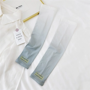 Detailed view of breathable ice silk sun sleeves with white to blue gradient and brand tag
