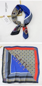 Detail view of square silk scarf showing geometric color blocks and houndstooth pattern