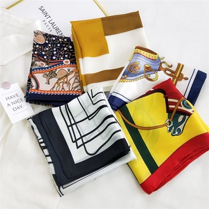 Collection of elegant silk scarves in various floral and geometric patterns for women