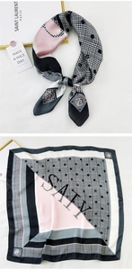 Detailed view of square satin scarf featuring geometric houndstooth and polka dot patterns