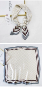 Detail of silk square scarf featuring vintage circular patterns and red wavy edge borders