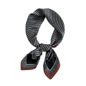 Satin square neck scarf featuring vintage black and white houndstooth with a red border